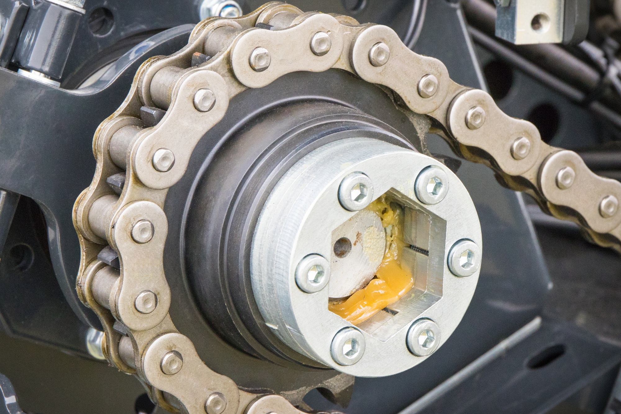 Metal chain and gear as part of agricultural and industrial machine. Technology